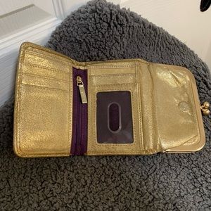 Hobo Gold Metallic Robin compact wallet.